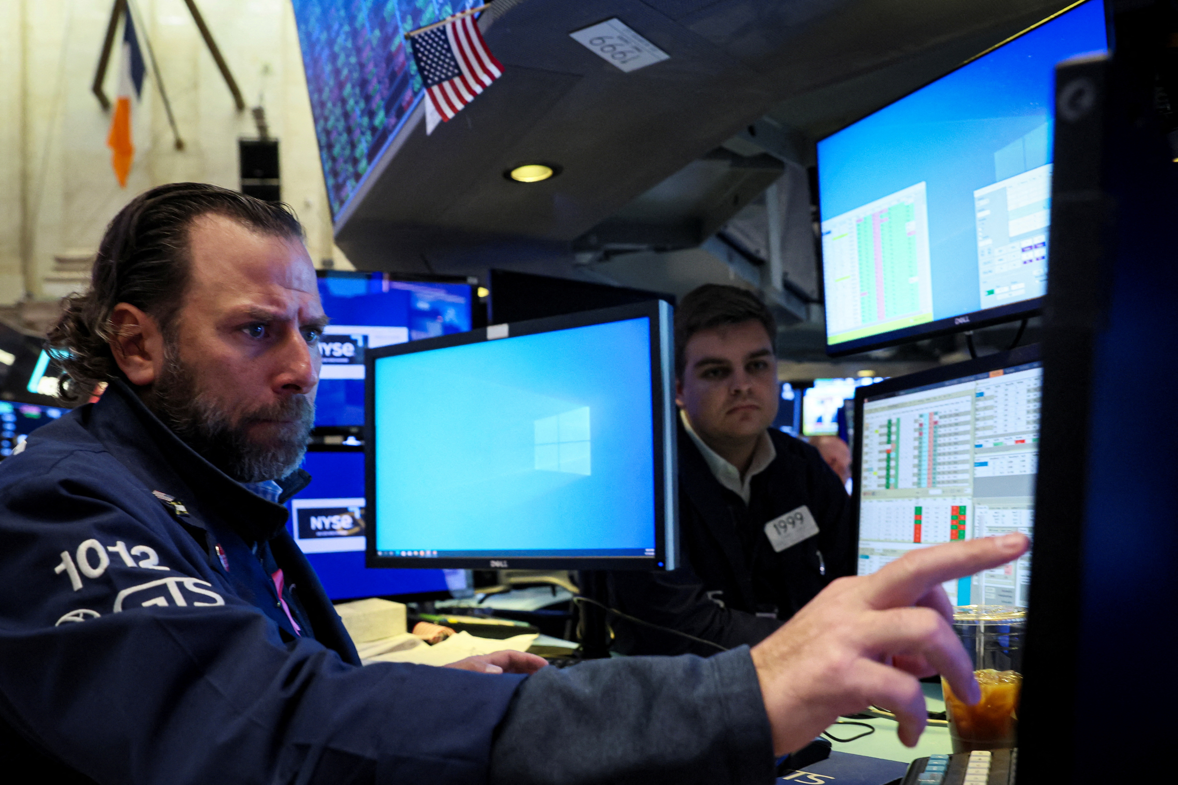 Traders work on the floor of the NYSE in New York