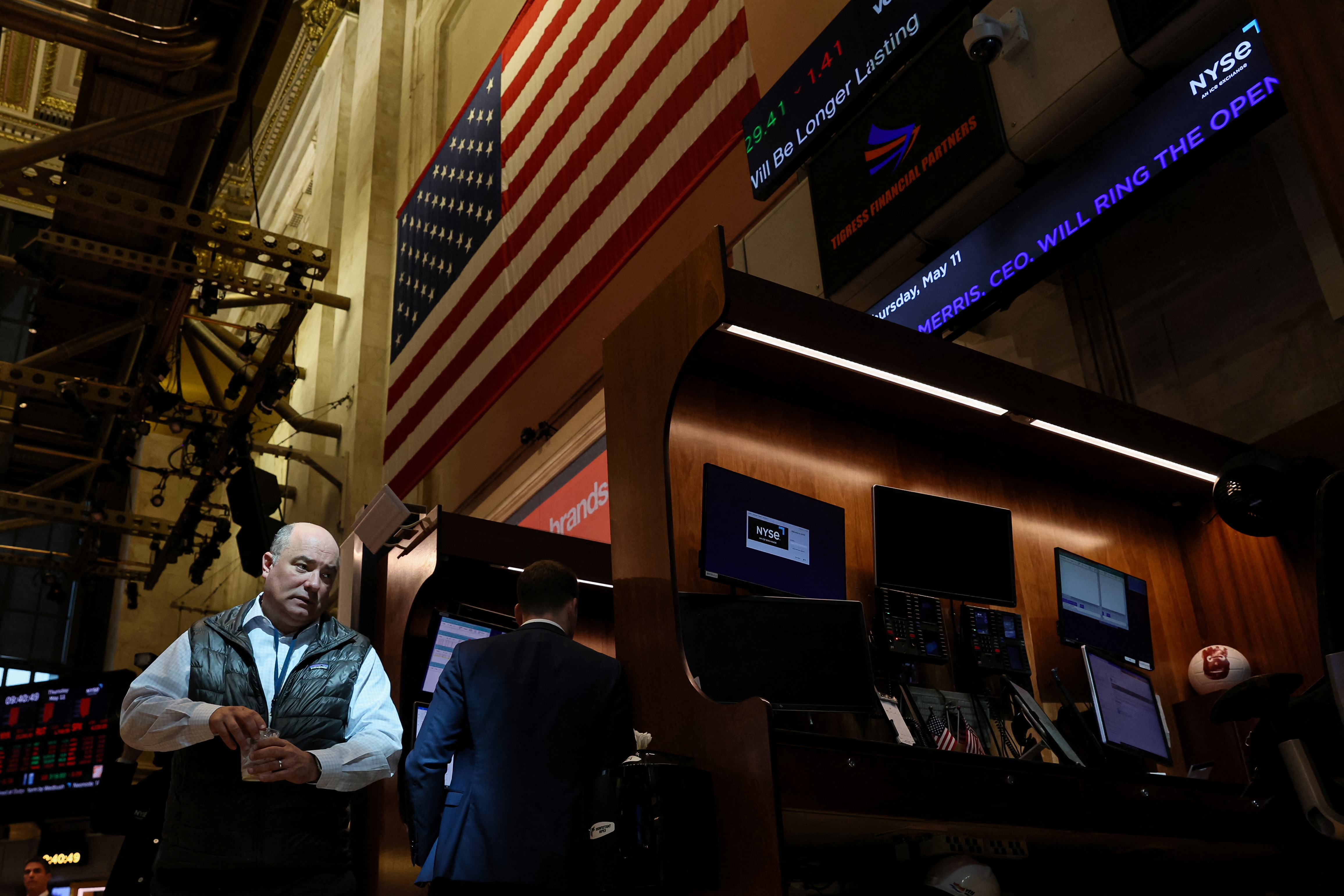 Traders work on the floor of the NYSE in New York