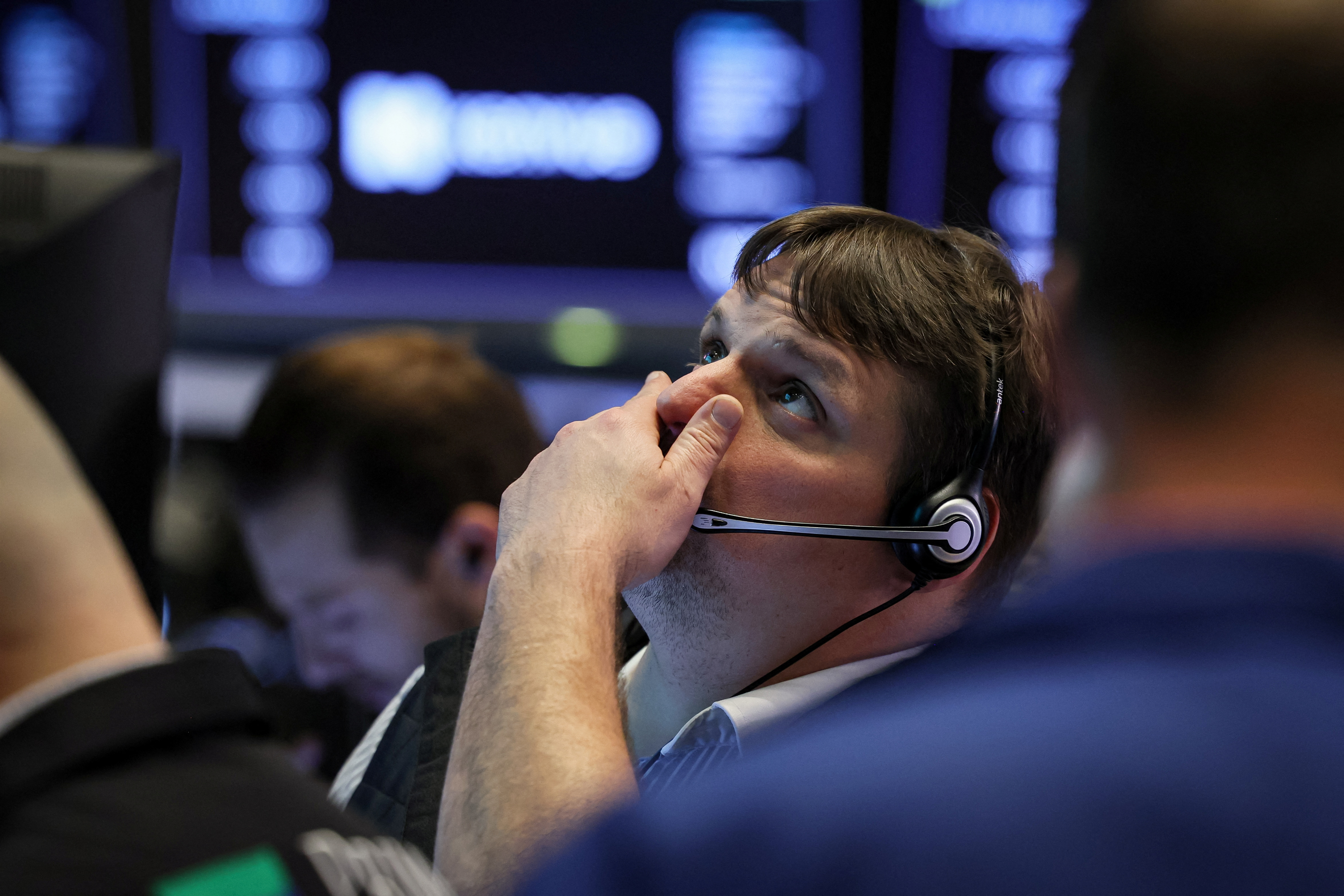 Traders work on the floor of the NYSE in New York