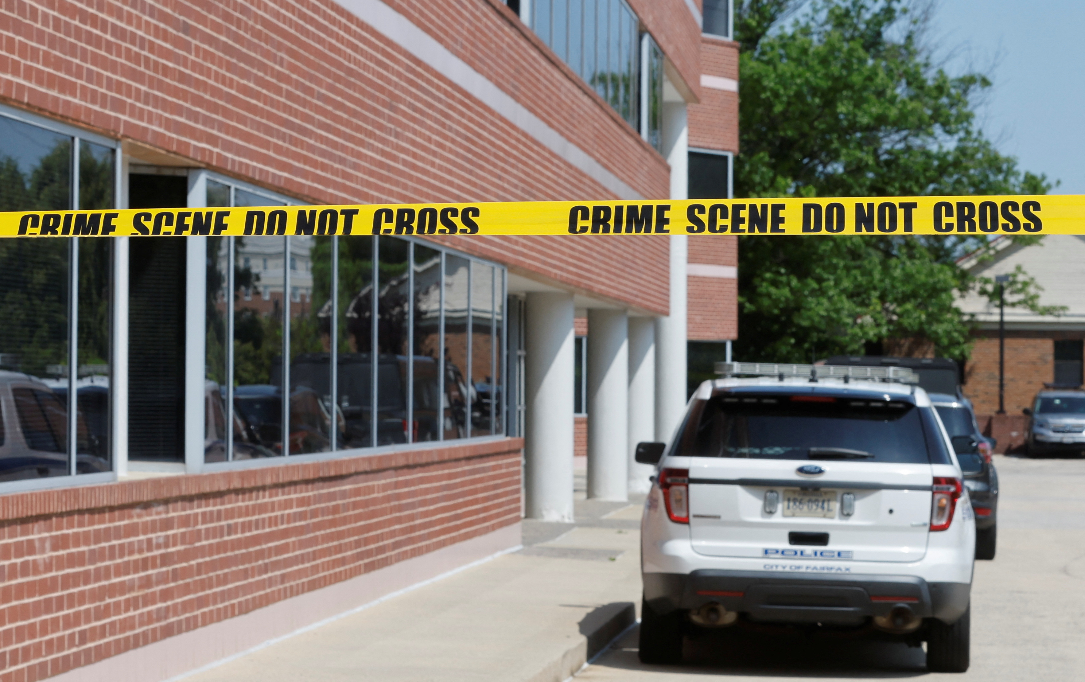A police cruiser sits outside the office of U.S. Rep. Gerry Connolly after baseball bat attack on his staff in Fairfax, Virginia