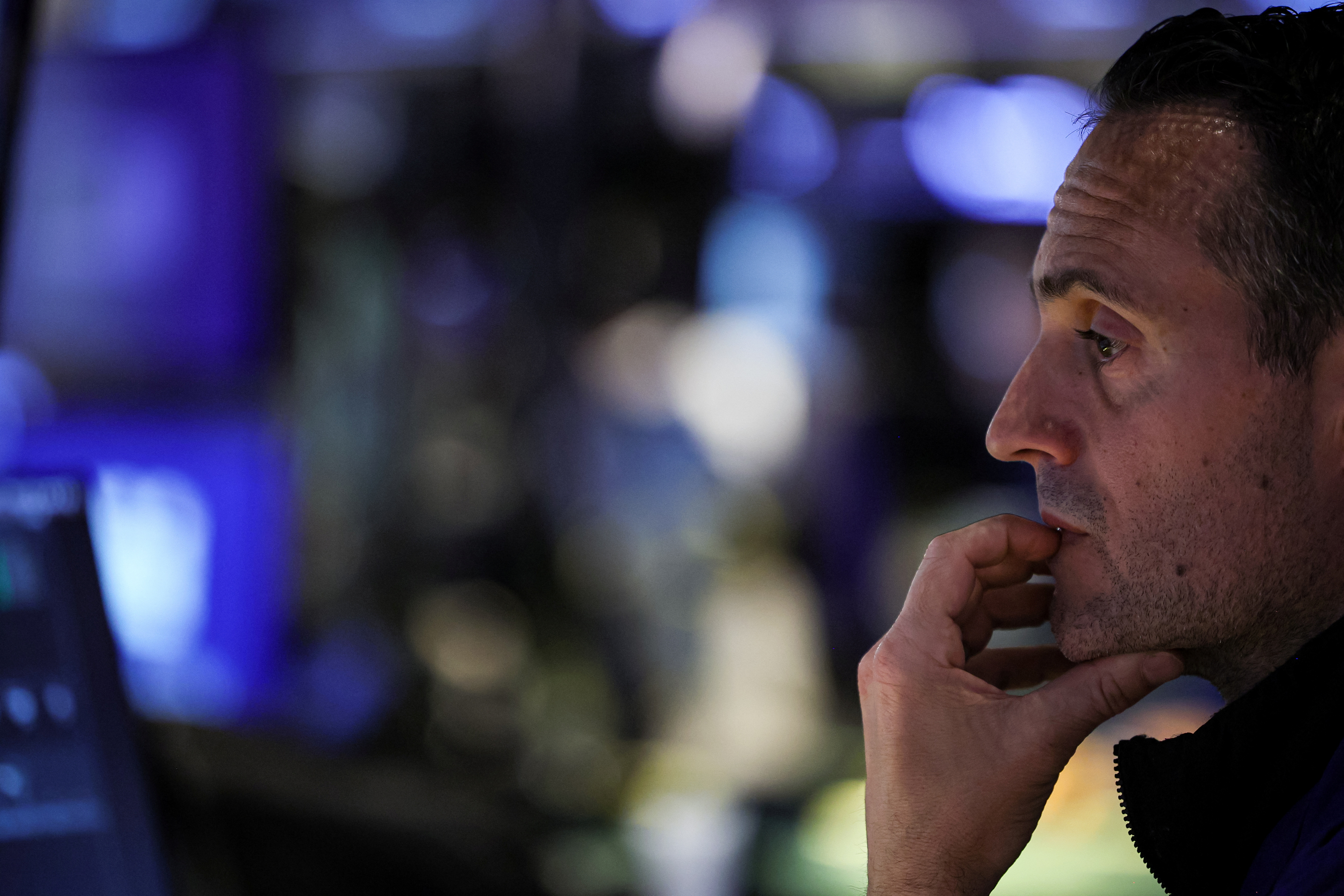 Traders work on the floor of the NYSE in New York