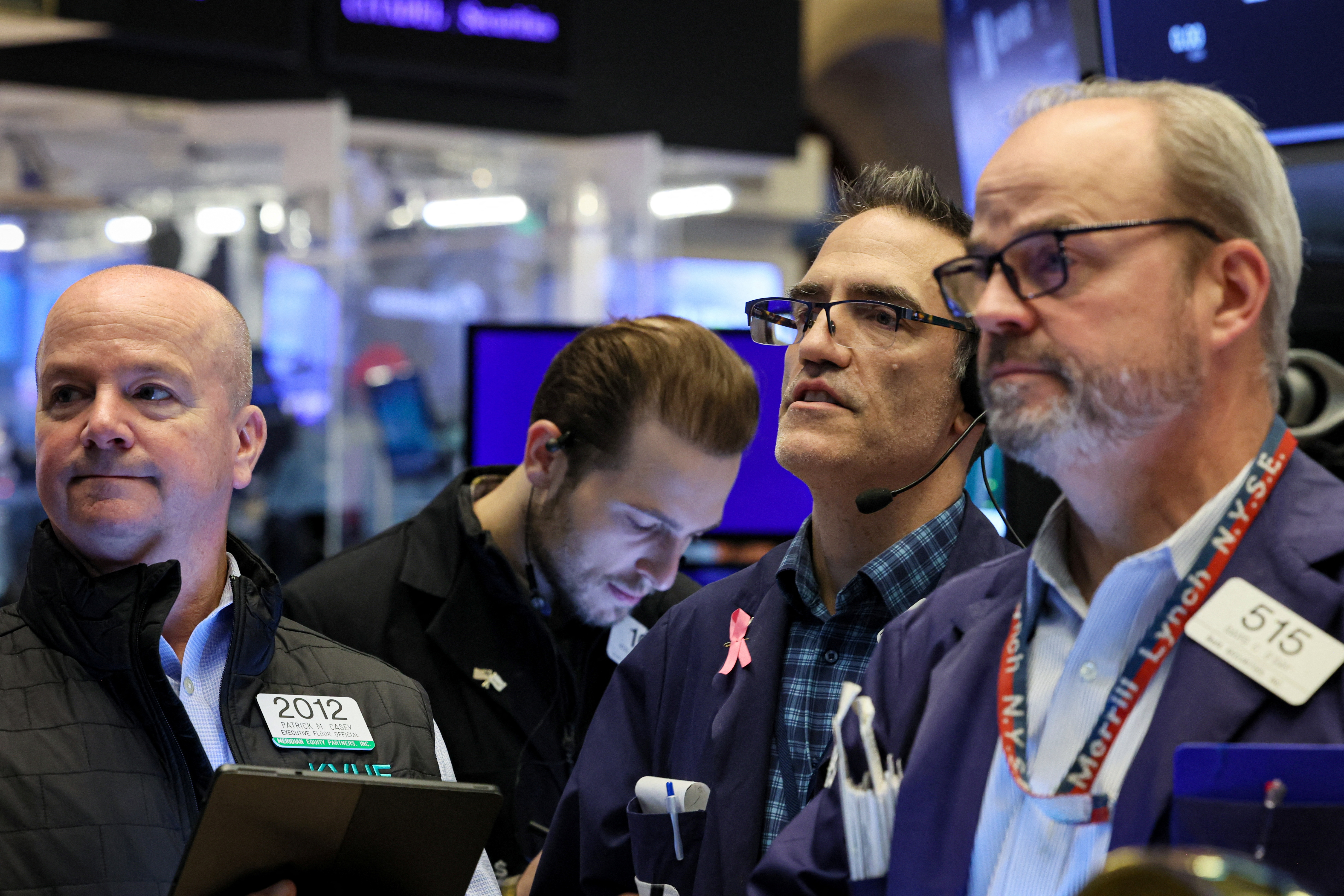 Traders work on the floor of the NYSE in New York