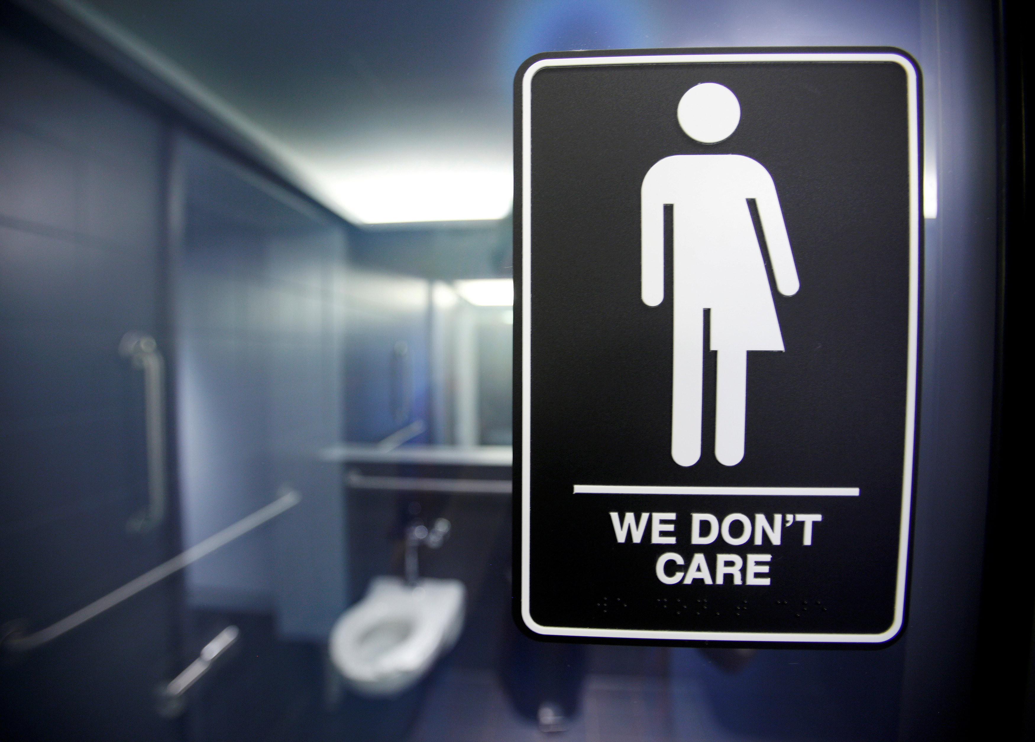 A sign protesting a recent North Carolina law restricting transgender bathroom access