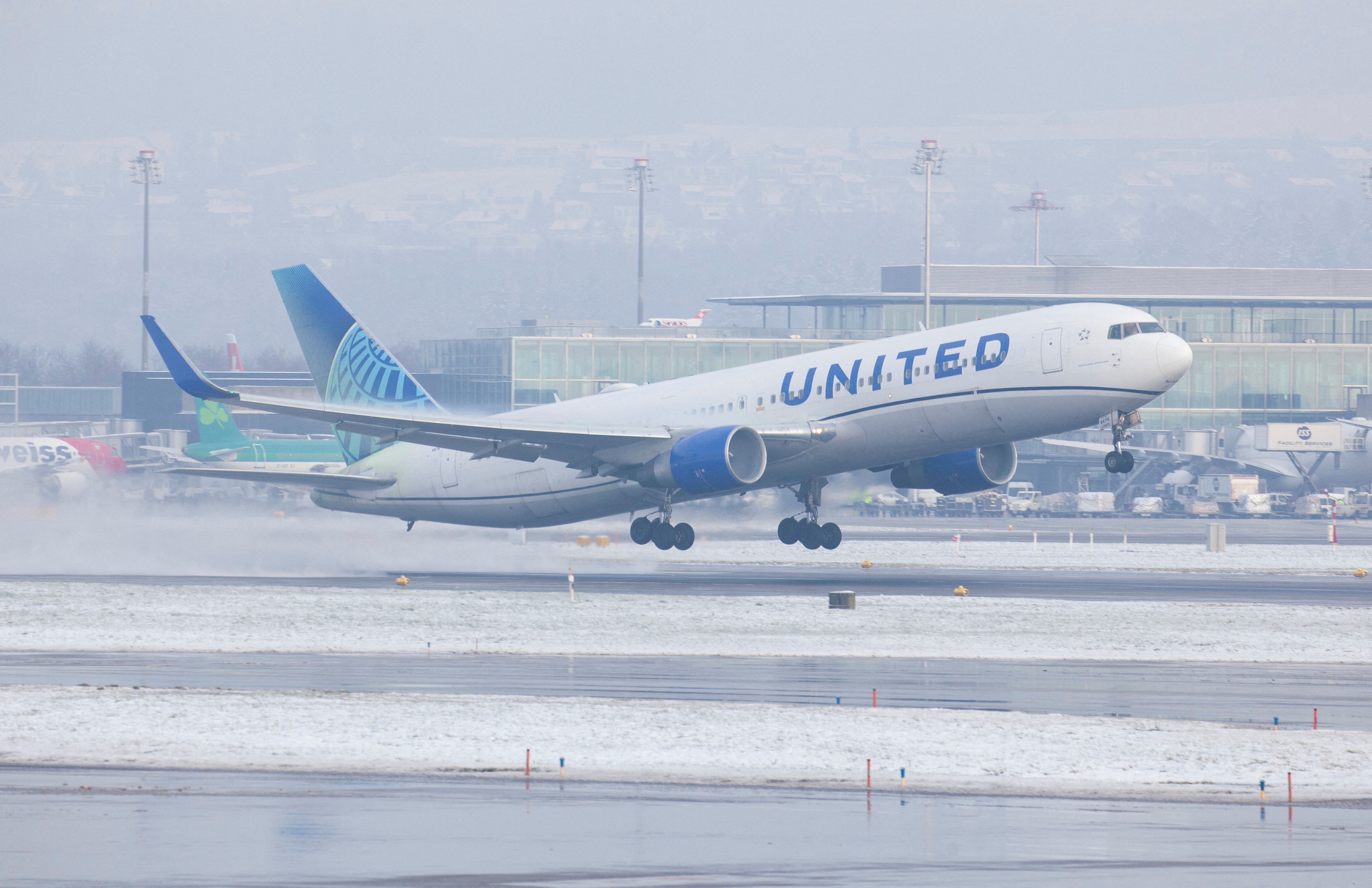 Boeing 767-322ER aircraft of United Airlines takes off from Zurich Airport near Ruemlang